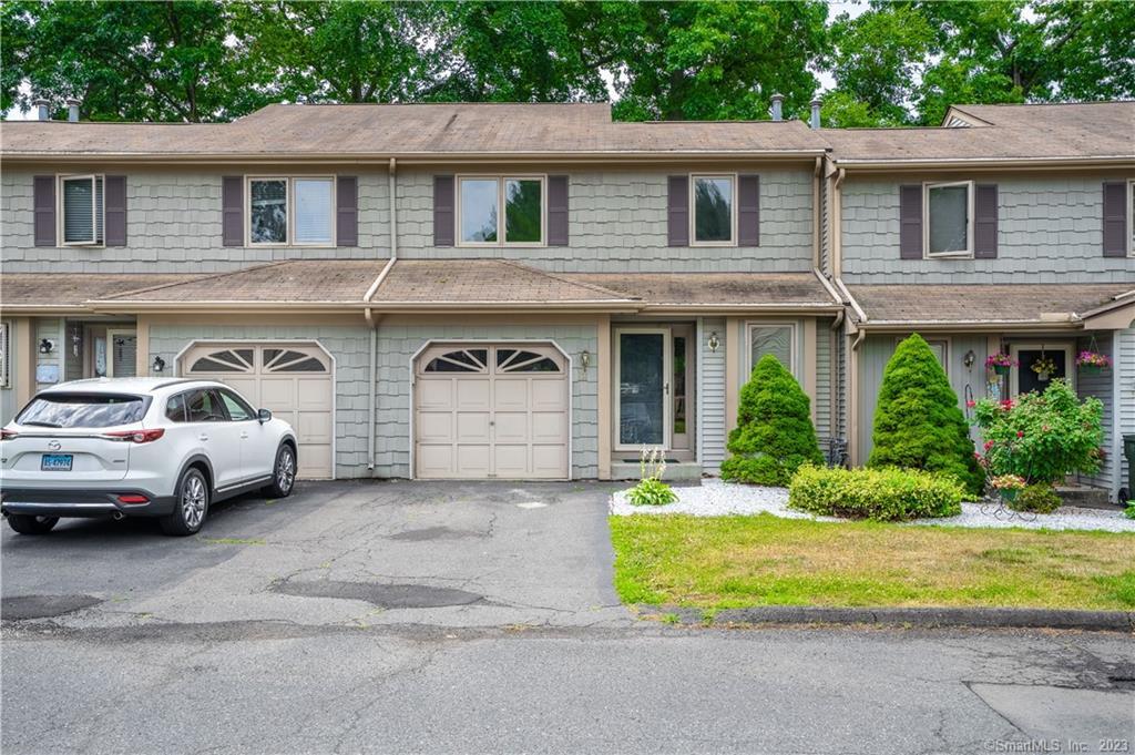 50 Scotland Road, Unit 5H East Hartford, CT 06108 - Photo 1 of 1 a view of multiple houses with a yard