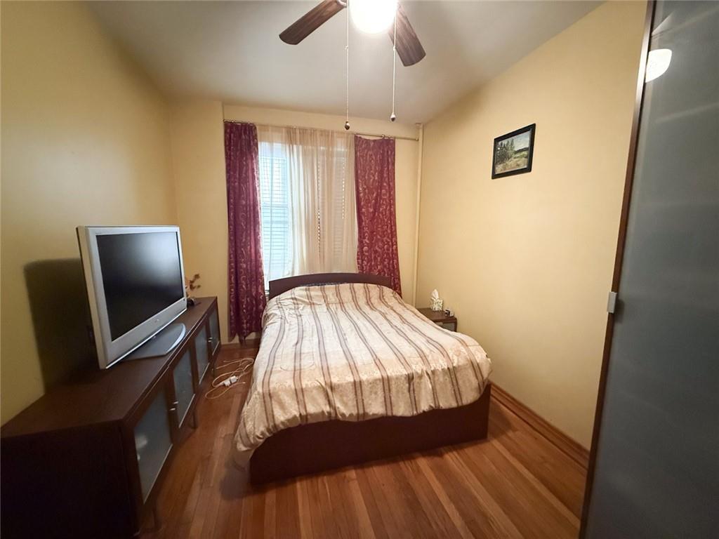 3039 Ocean Parkway, Unit B6 Brooklyn, NY 11235 - Photo 11 of 12 a bedroom with a bed and a flat screen tv
