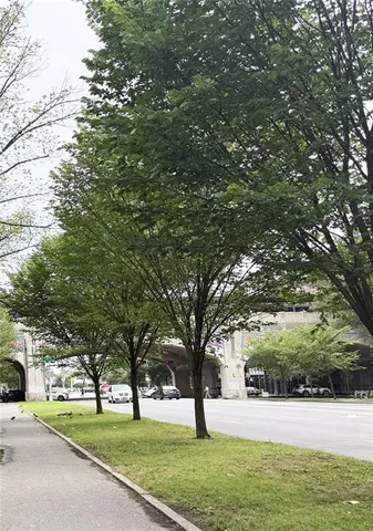 a kitchen with a stove a sink and a window