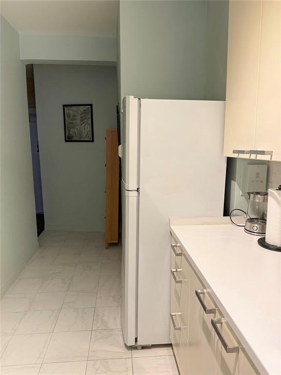 3039 Ocean Parkway, Unit B6 Brooklyn, NY 11235 - Photo 4 of 12 a kitchen with a refrigerator and a sink