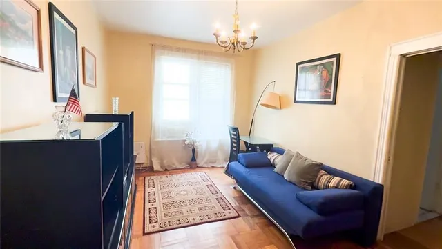 a view of a living room with a baby crib