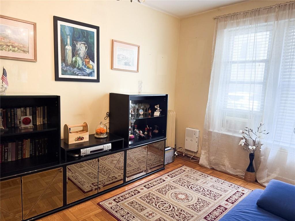 3039 Ocean Parkway, Unit B6 Brooklyn, NY 11235 - Photo 7 of 12 a view of a living room with a baby crib