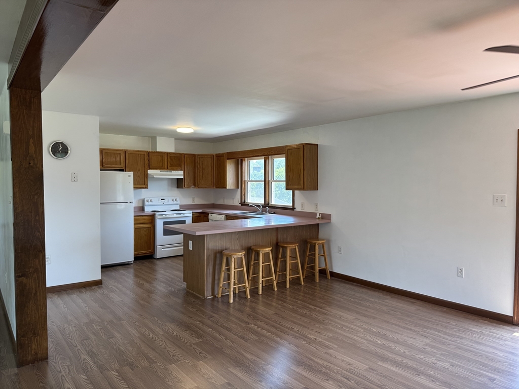99 Spring Street Rehoboth, MA 02769 - Photo 4 of 8 a kitchen with a table and chairs