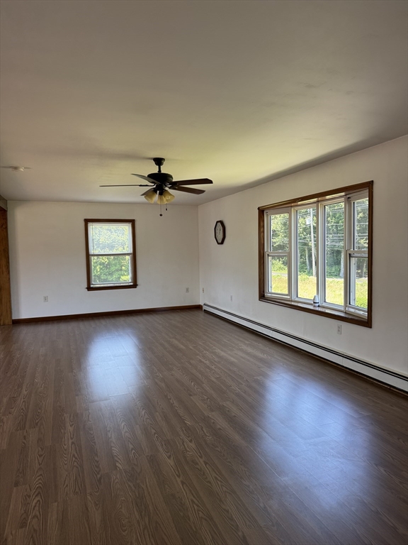 99 Spring Street Rehoboth, MA 02769 - Photo 6 of 8 a view of an empty room with wooden floor and a window