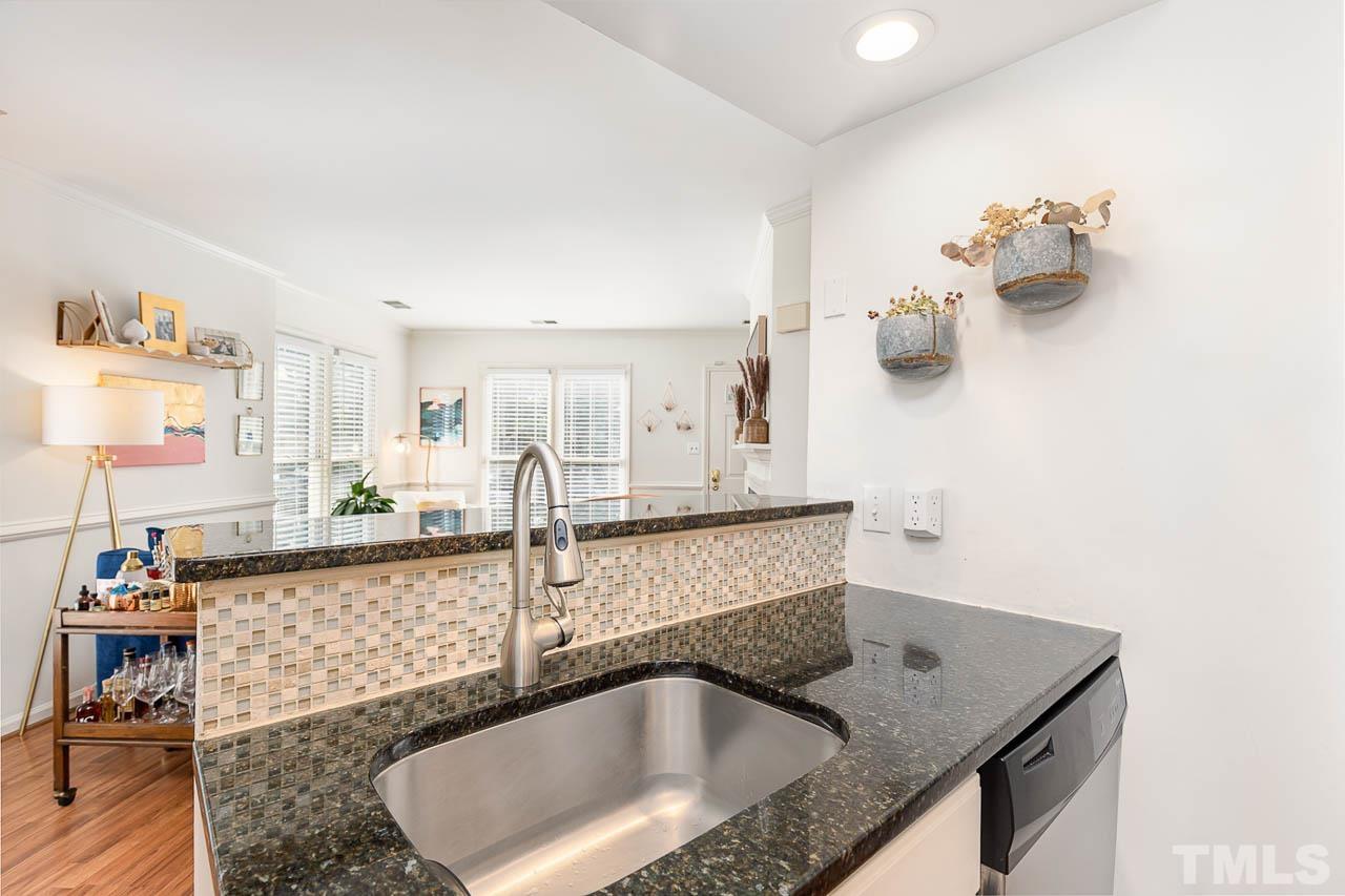 1400 Barton Pl Drive Raleigh, NC 27608 - Photo 11 of 25 a bathroom with a granite countertop sink a mirror and bathtub