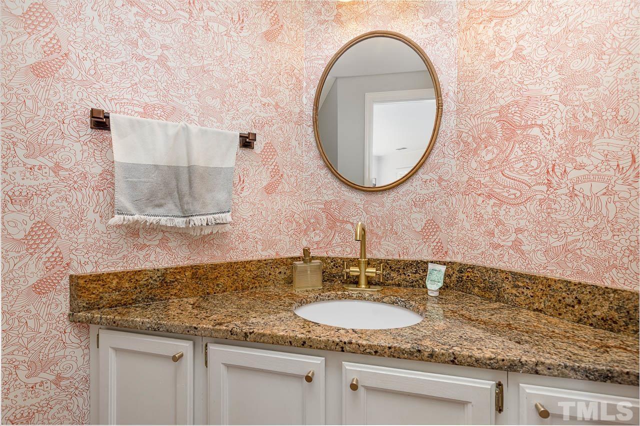 1400 Barton Pl Drive Raleigh, NC 27608 - Photo 13 of 25 a bathroom with a granite countertop sink and a mirror