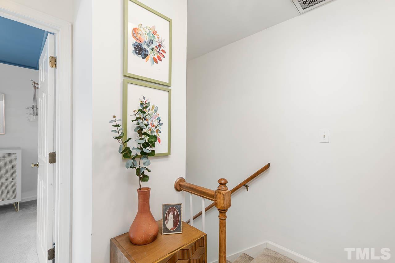 1400 Barton Pl Drive Raleigh, NC 27608 - Photo 15 of 25 a vase of flowers sitting on a table