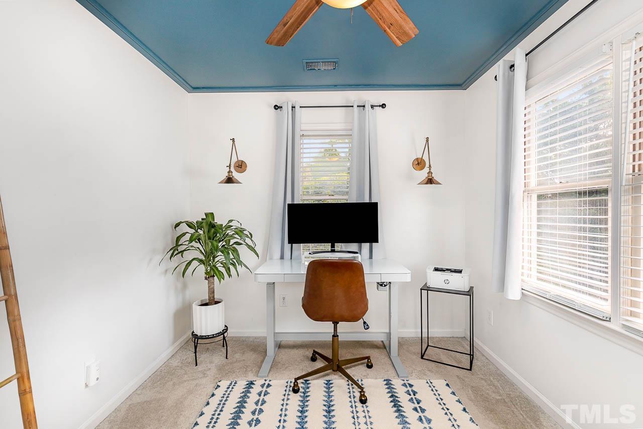 1400 Barton Pl Drive Raleigh, NC 27608 - Photo 22 of 25 a living room with furniture and a potted plant
