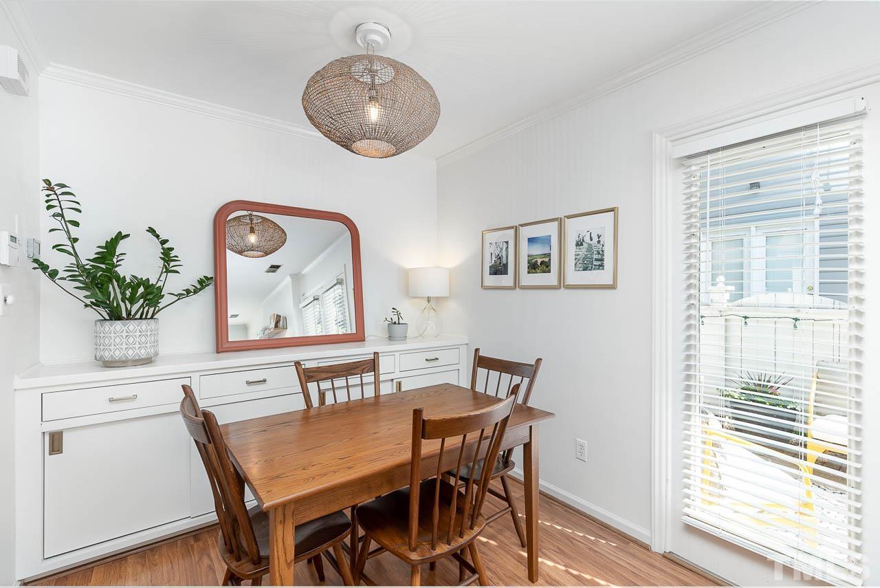 1400 Barton Pl Drive Raleigh, NC 27608 - Photo 6 of 25 a view of a dining room with furniture and a window