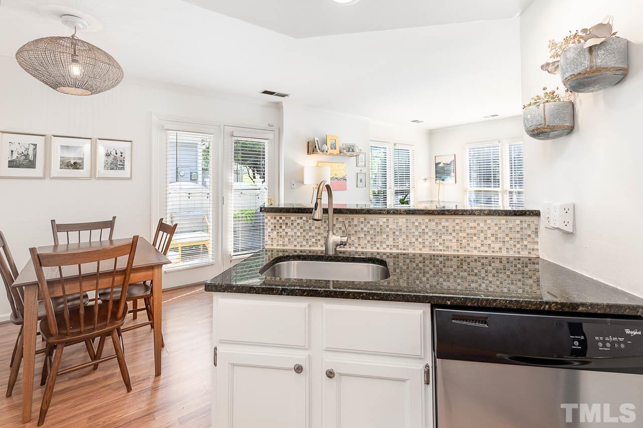1400 Barton Pl Drive Raleigh, NC 27608 - Photo 9 of 25 a kitchen with a sink and cabinets