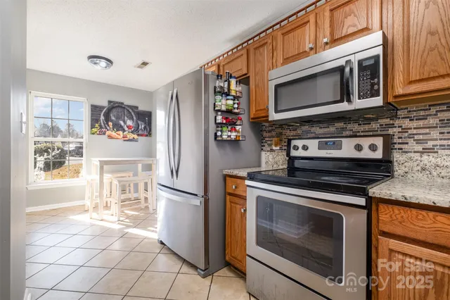 a kitchen with a stove and a microwave
