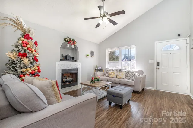 a living room with furniture and a fireplace