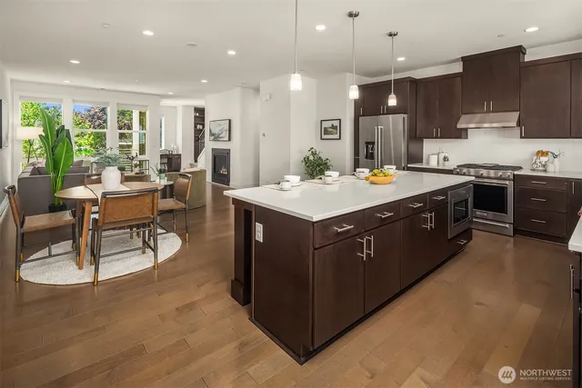 a kitchen with a sink stove and wooden cabinets