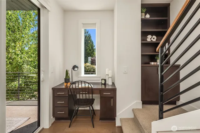 a view of a room with a table and chairs