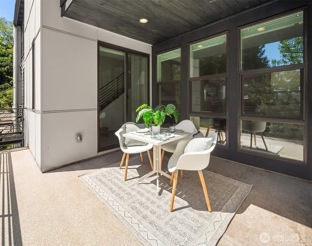 a outdoor space with a couch and chairs