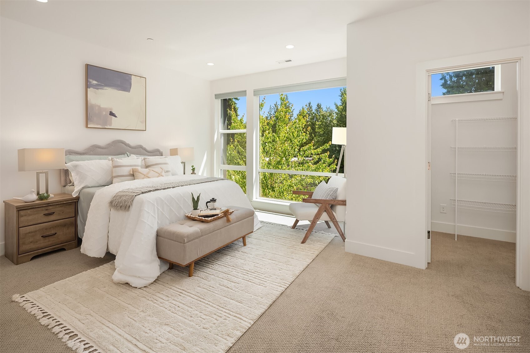 9604 Main Street, Unit C Bothell, WA 98011 - Photo 17 of 32 a bedroom with a bed and a large window