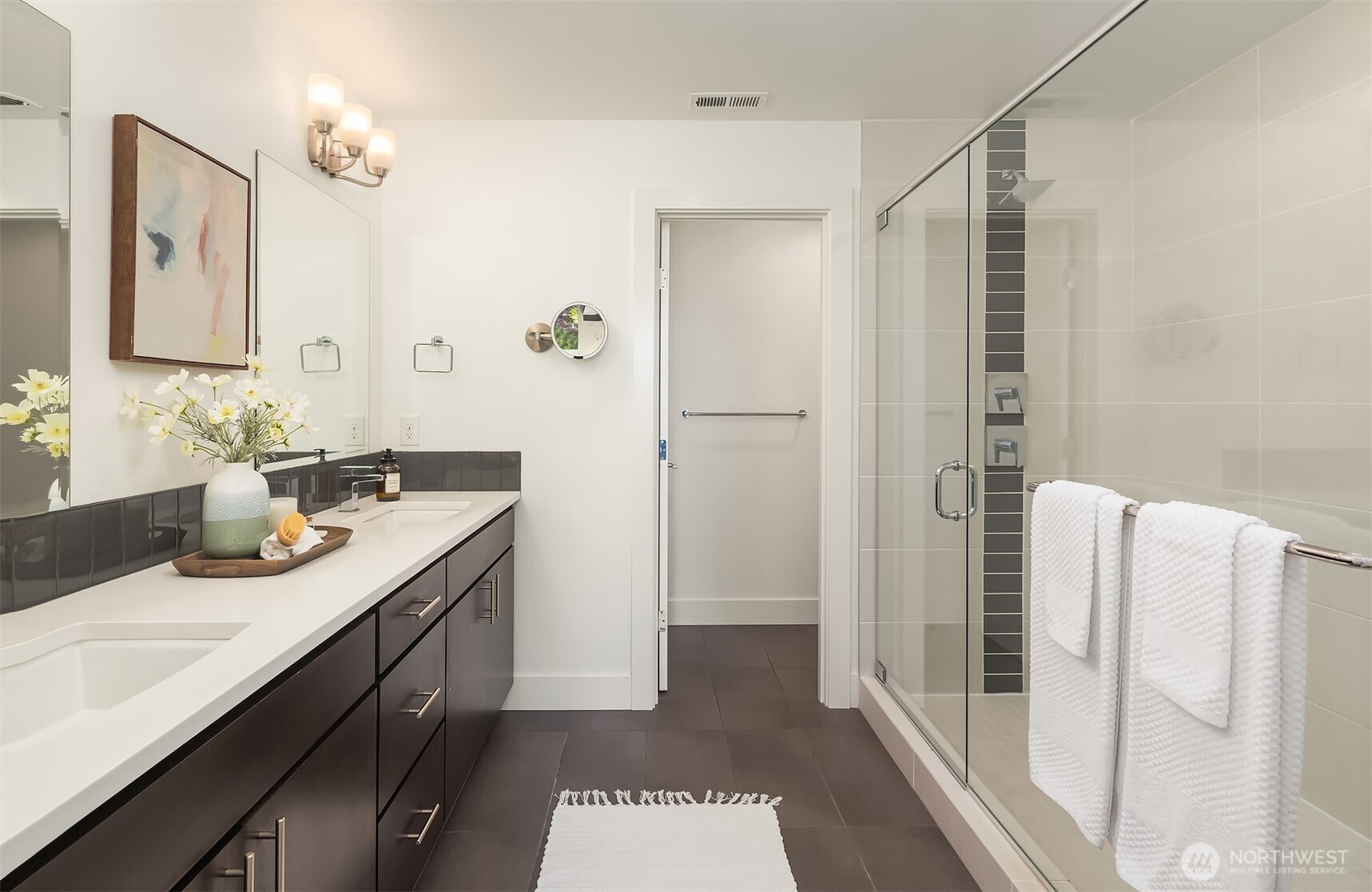 9604 Main Street, Unit C Bothell, WA 98011 - Photo 19 of 32 a bathroom with a sink and a mirror