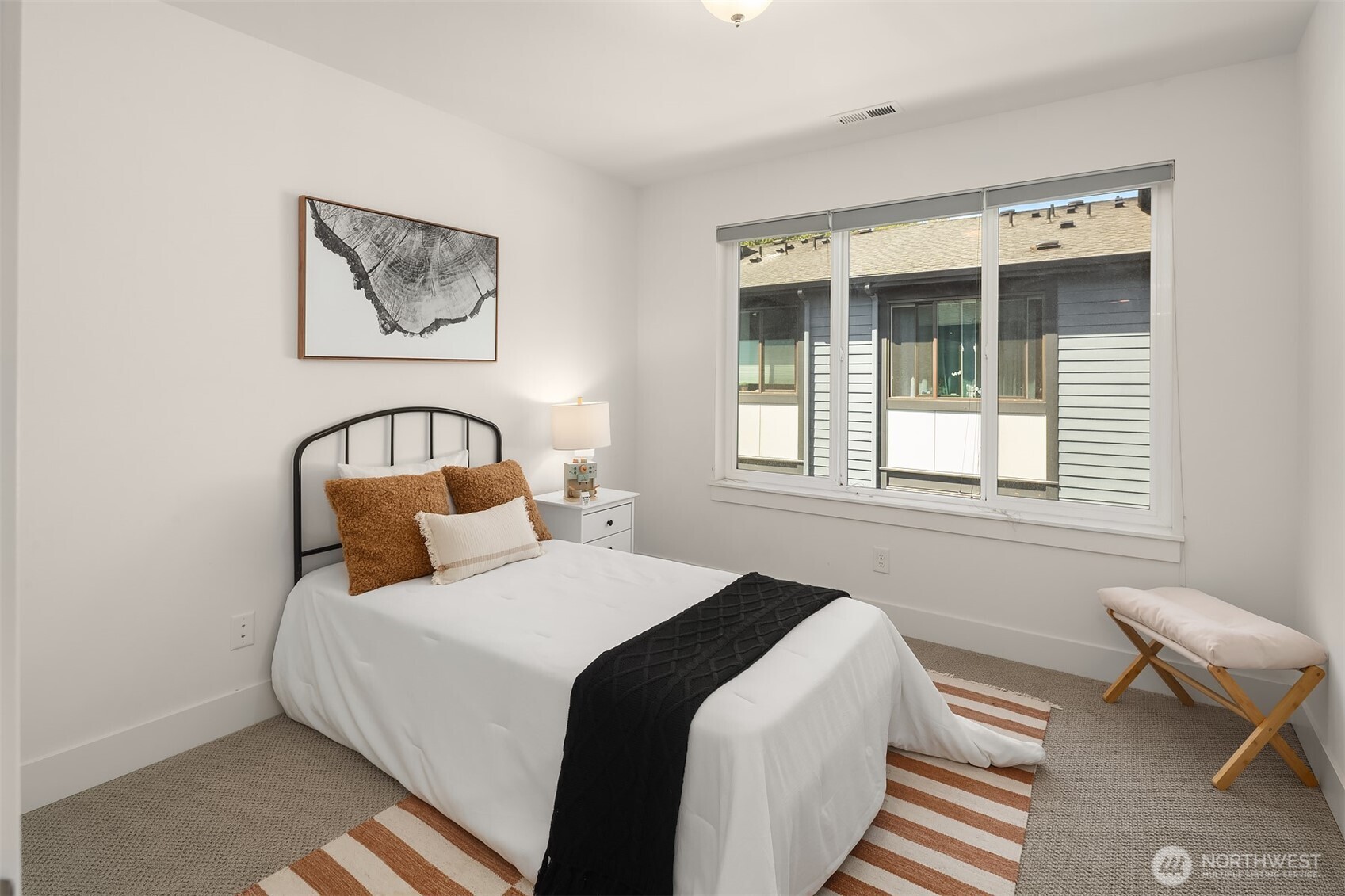 9604 Main Street, Unit C Bothell, WA 98011 - Photo 22 of 32 a bedroom with bed and a window