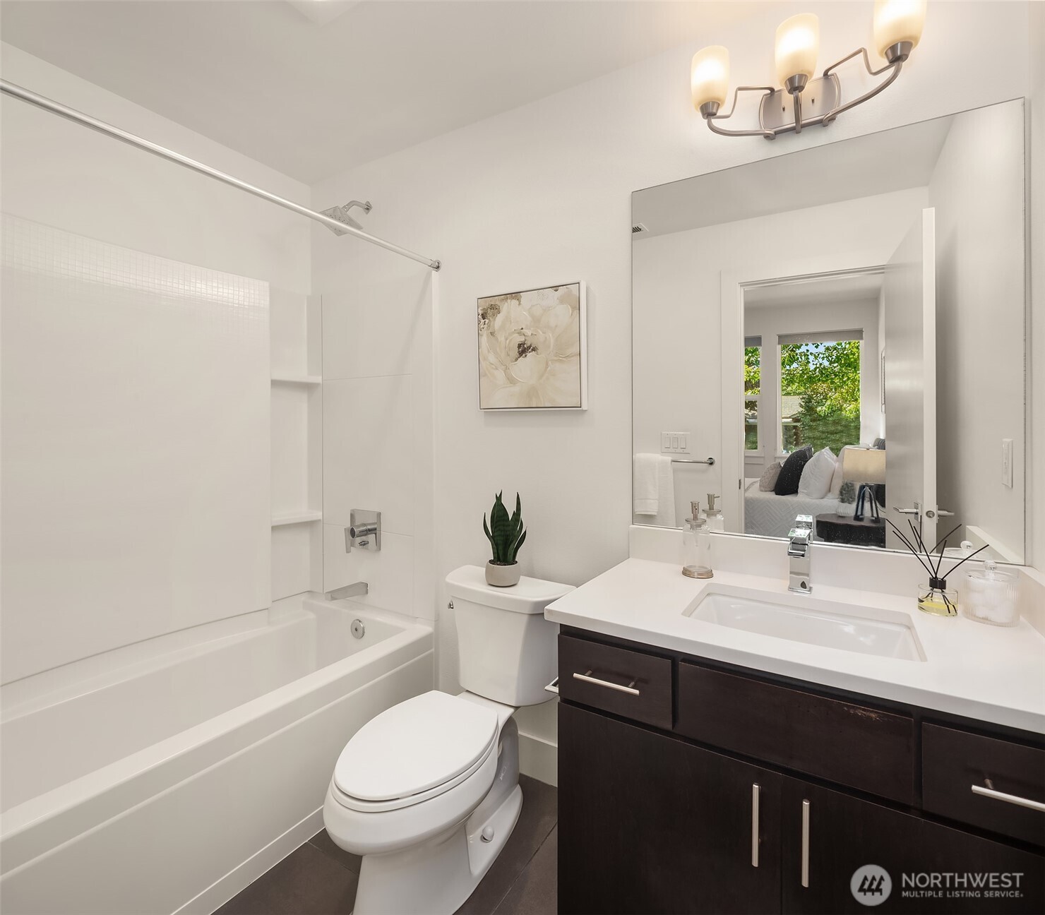 9604 Main Street, Unit C Bothell, WA 98011 - Photo 27 of 32 a bathroom with a sink a toilet and a bathtub