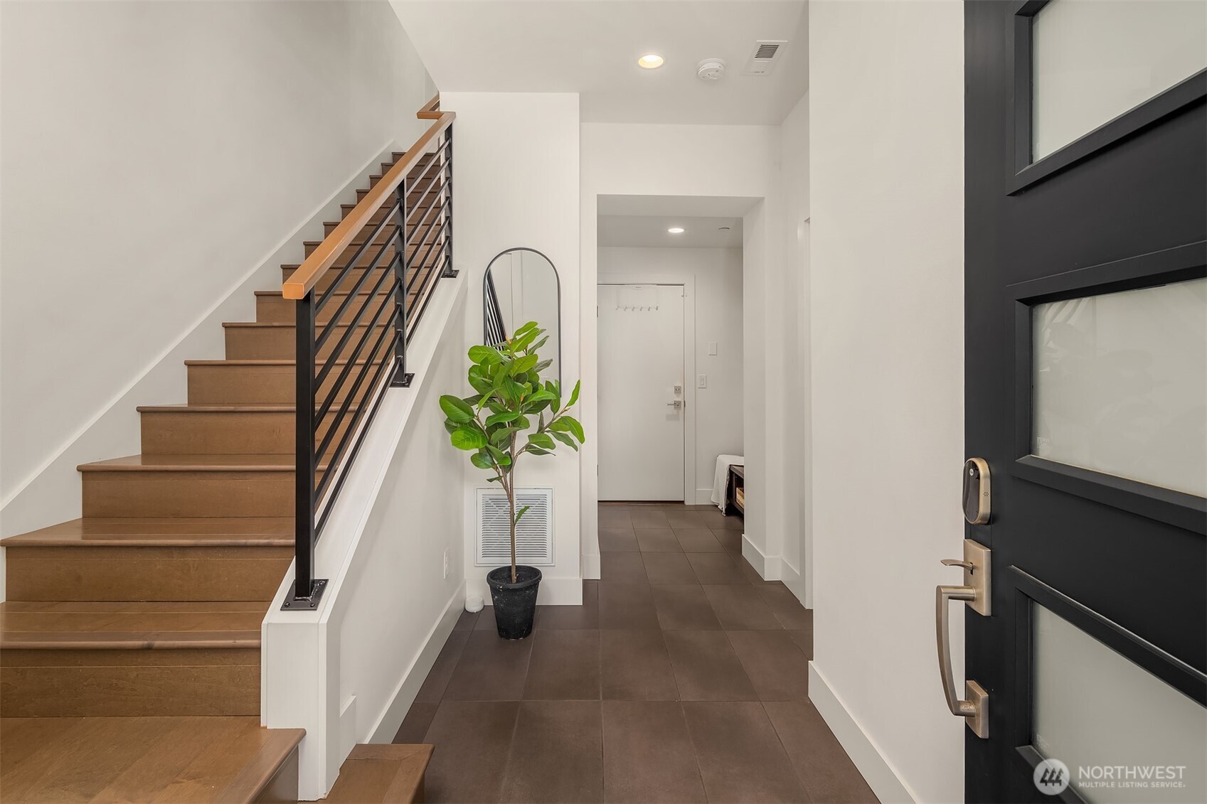 9604 Main Street, Unit C Bothell, WA 98011 - Photo 3 of 32 a view of an entryway with wooden floor