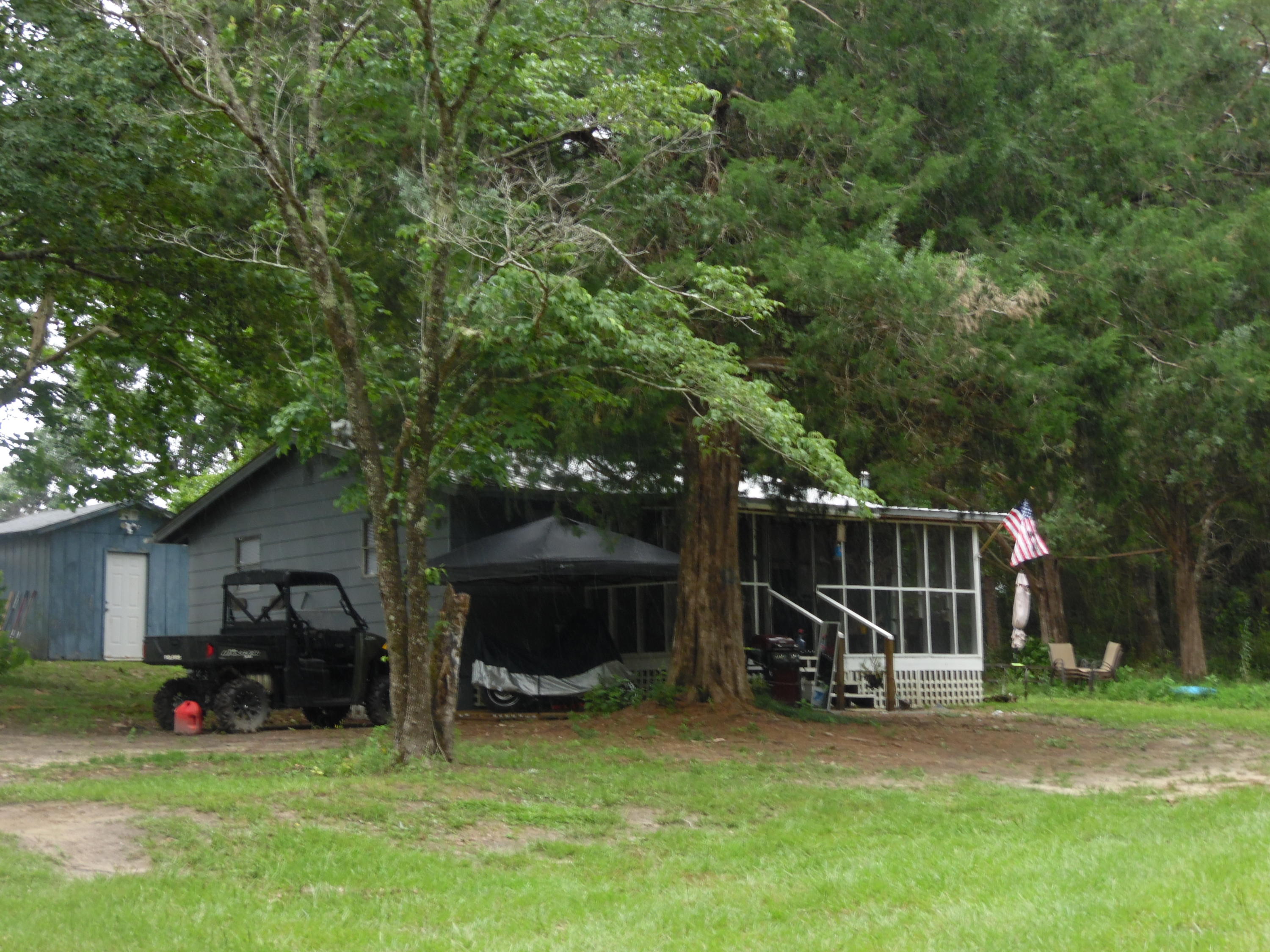 a view of a house with backyard and a slide