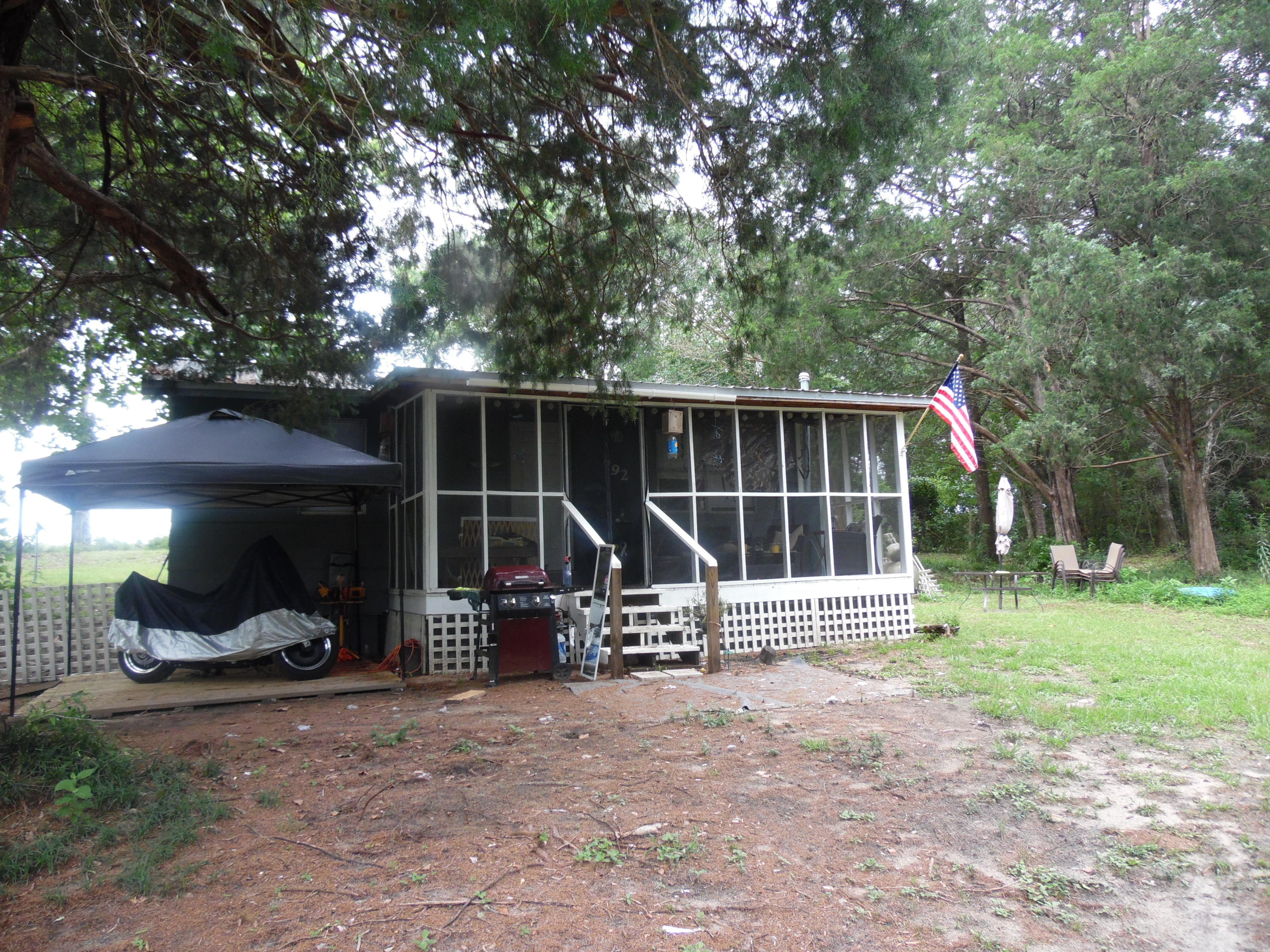 792 Mims Road DeFuniak Springs, FL 32433 - Photo 2 of 16 a view of parked car in front of house