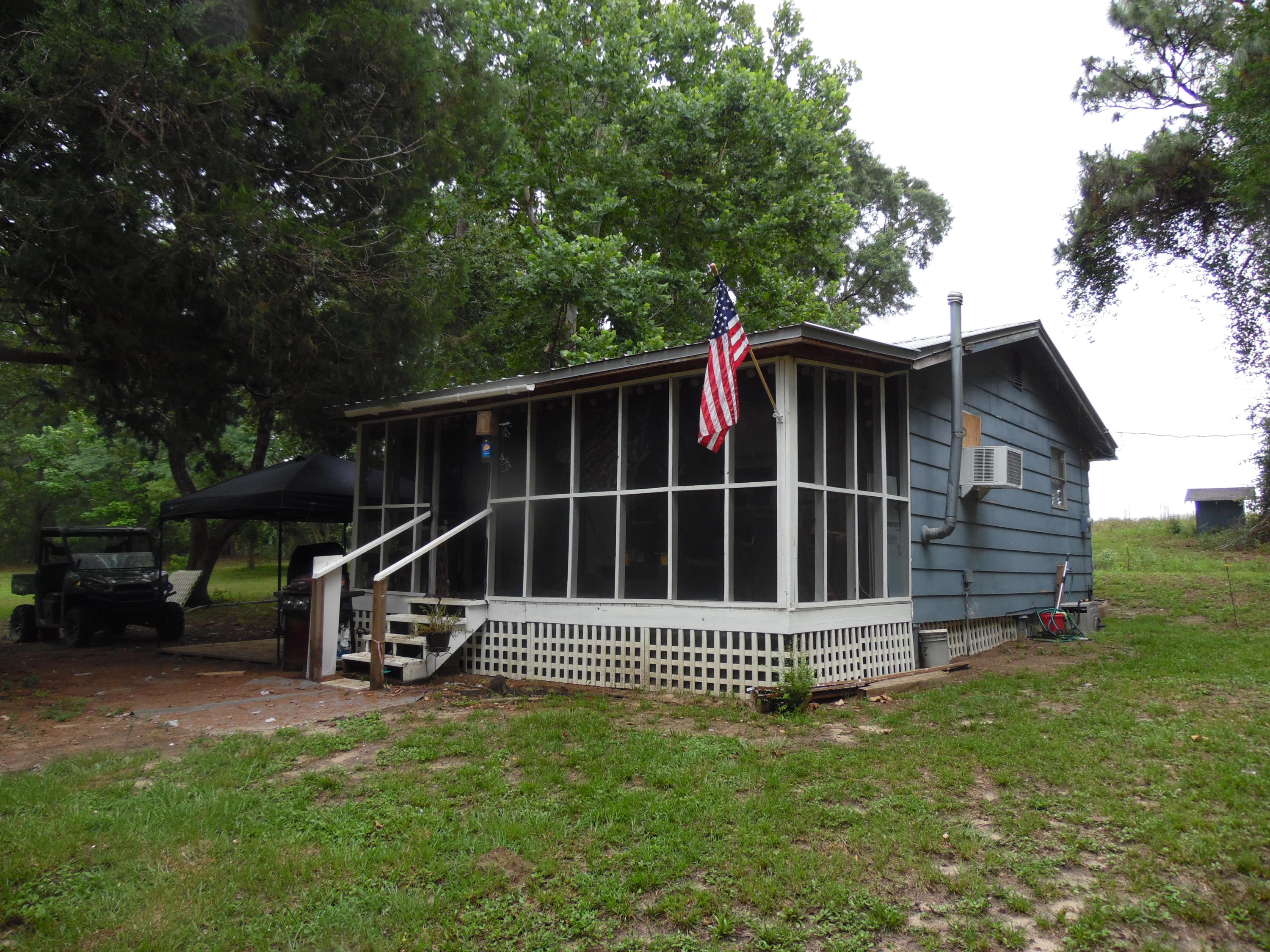 792 Mims Road DeFuniak Springs, FL 32433 - Photo 3 of 16 a view of a small deck with a small yard