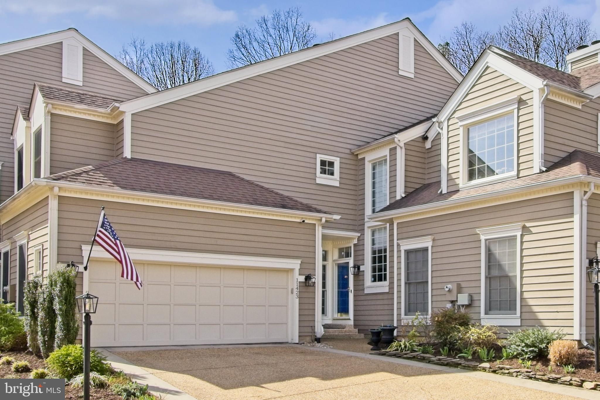11423 Hollow Timber Way Reston, VA 20194 - Photo 1 of 68 a small white building with a white roof and a large tree