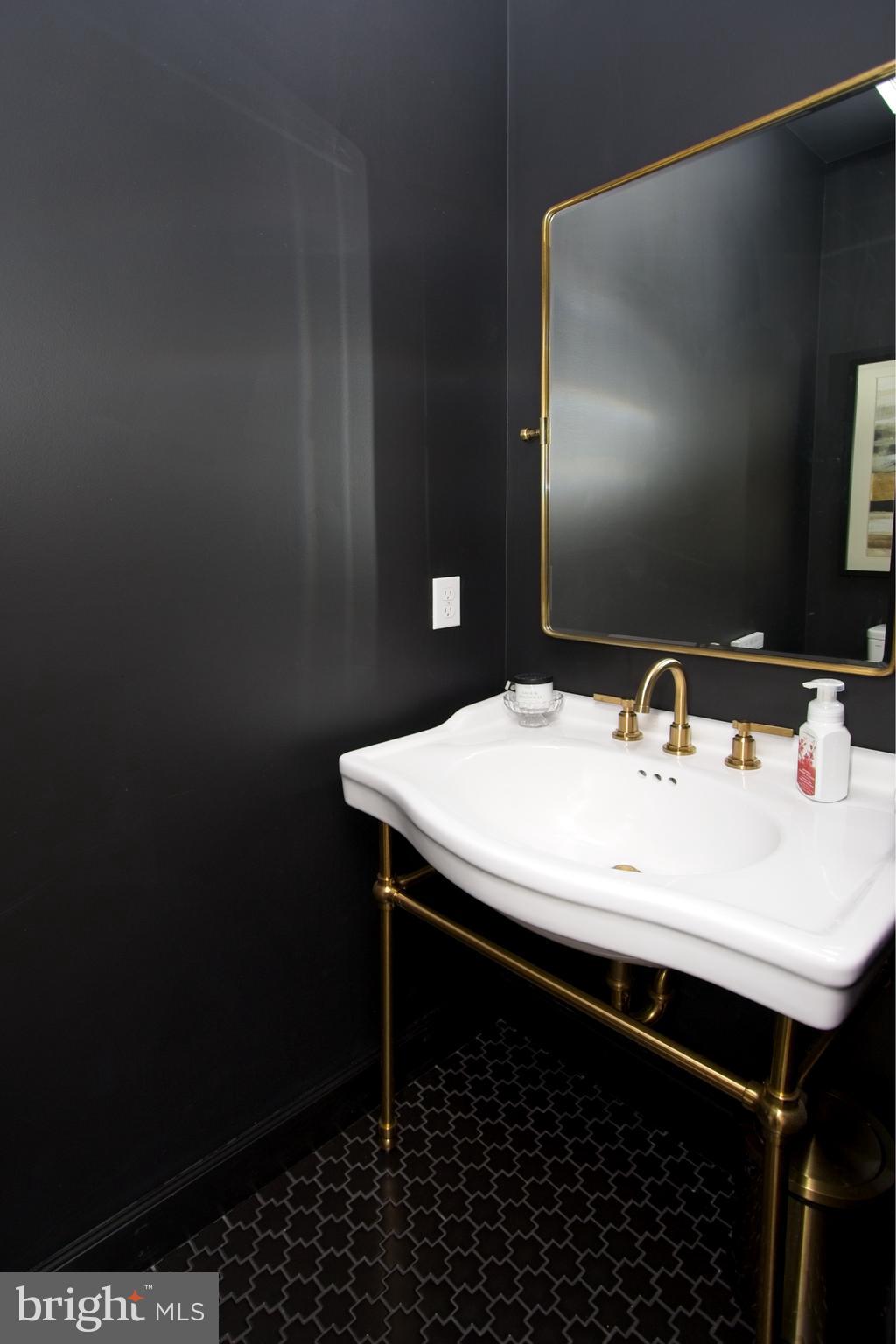 11423 Hollow Timber Way Reston, VA 20194 - Photo 22 of 68 a close up of a sink and a mirror