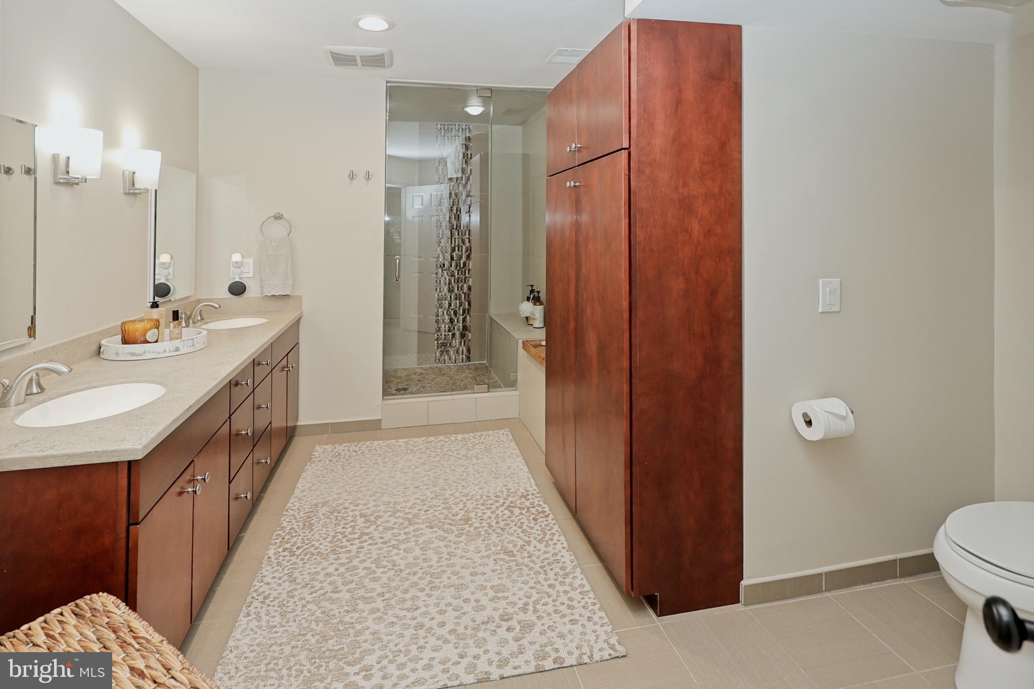11423 Hollow Timber Way Reston, VA 20194 - Photo 29 of 68 Primary bathroom offers double sinks, steam shower