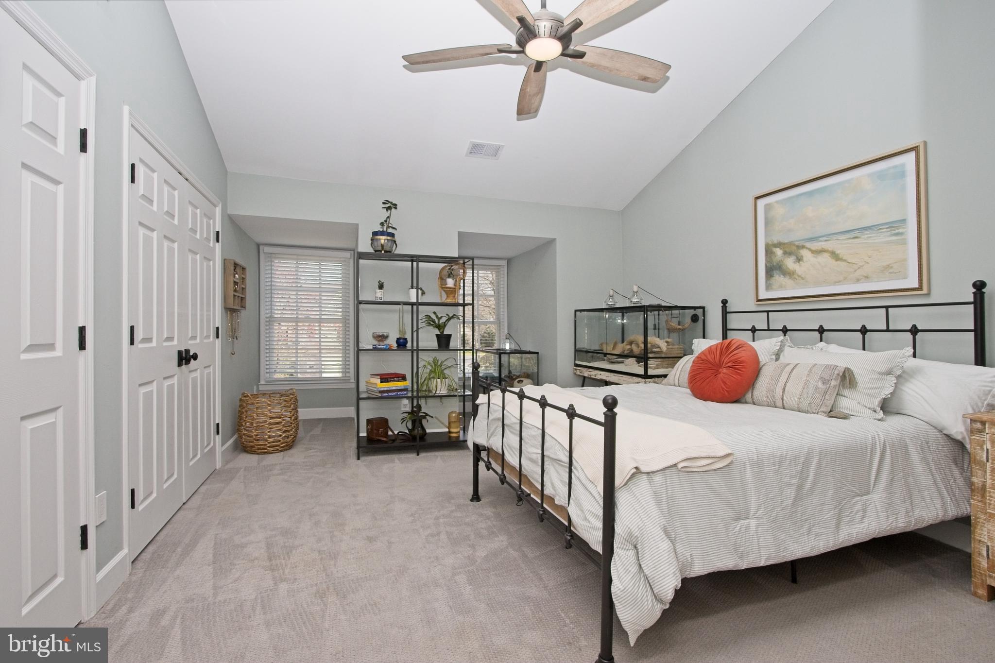11423 Hollow Timber Way Reston, VA 20194 - Photo 31 of 68 a bedroom with a bed and a walk in closet