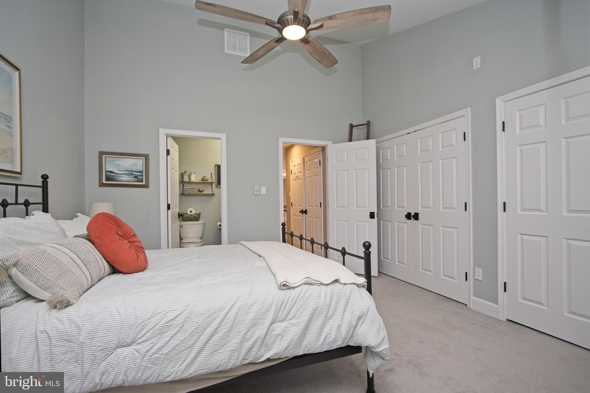 11423 Hollow Timber Way Reston, VA 20194 - Photo 32 of 68 a bedroom with a bed and a chandelier