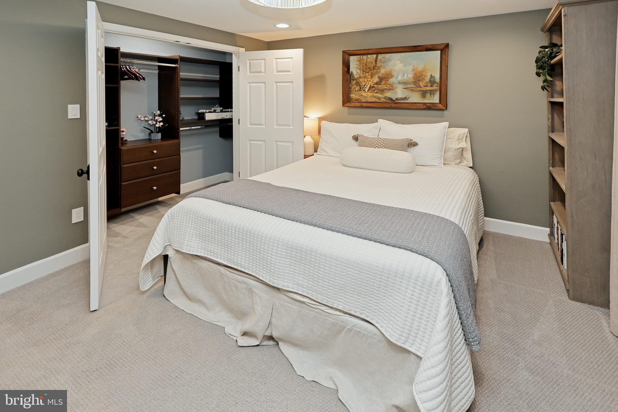 11423 Hollow Timber Way Reston, VA 20194 - Photo 40 of 68 a bedroom with a bed and a tv on the dresser