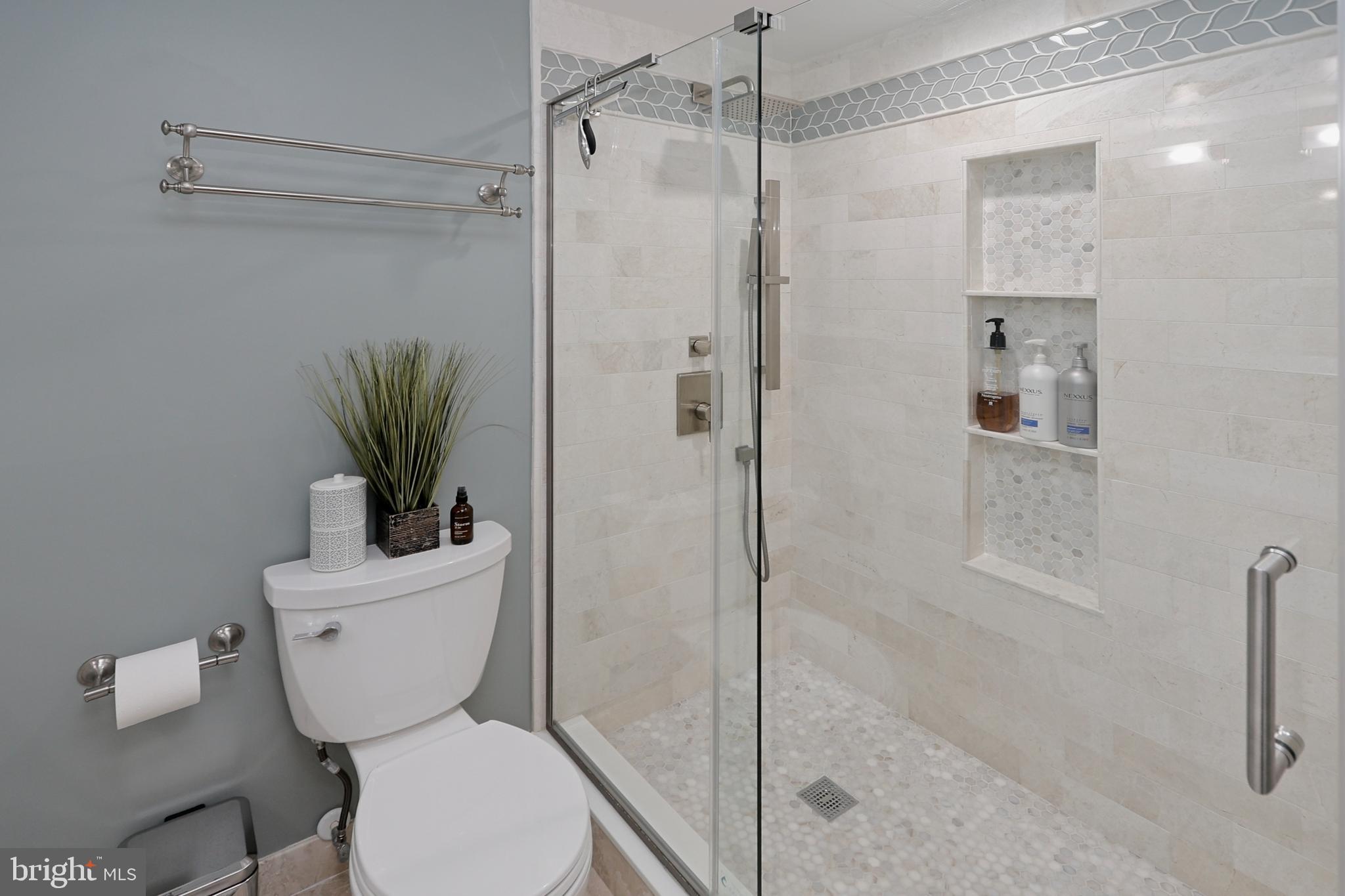 11423 Hollow Timber Way Reston, VA 20194 - Photo 43 of 68 a bathroom with a toilet a sink and shower