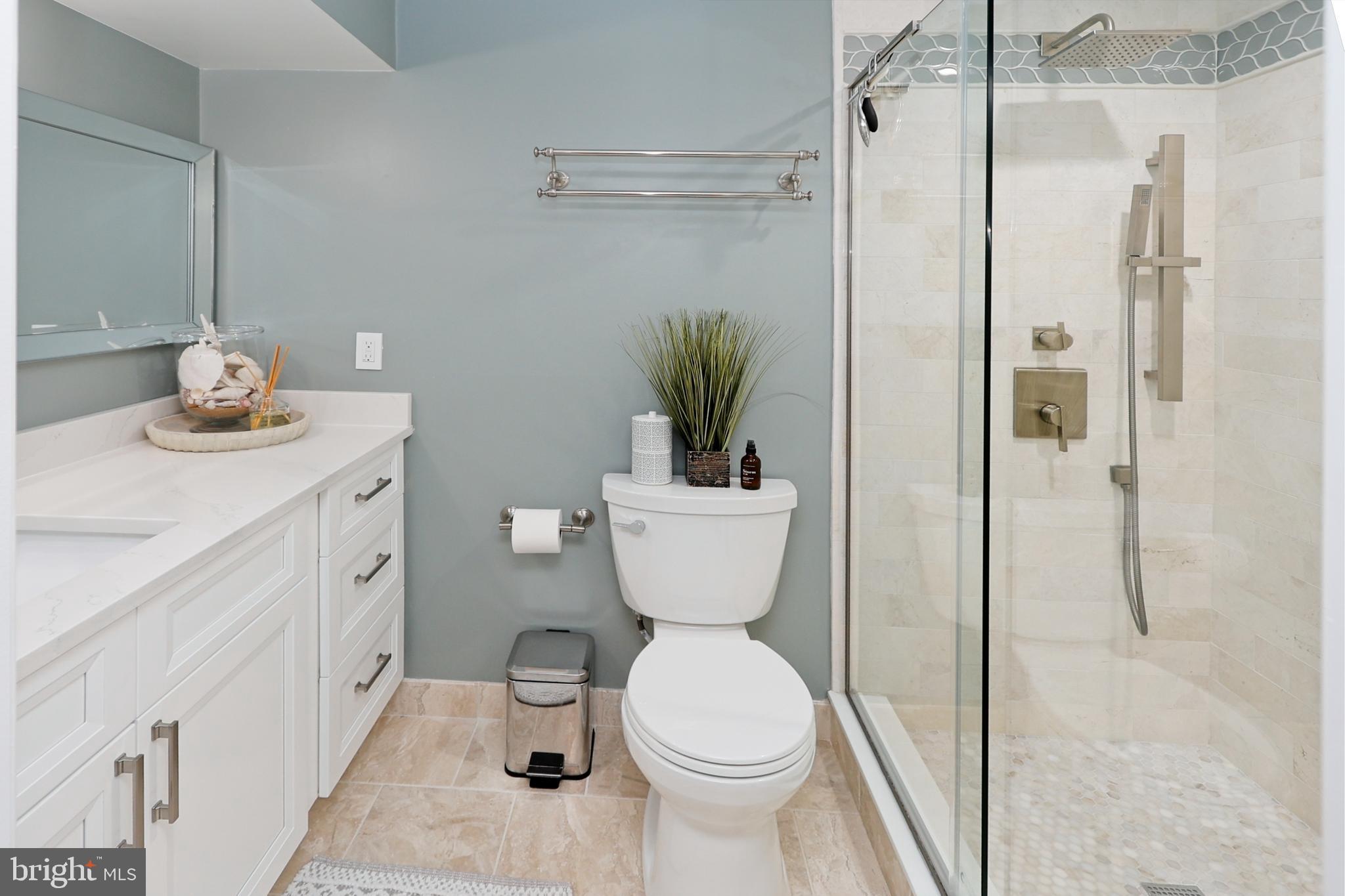 11423 Hollow Timber Way Reston, VA 20194 - Photo 44 of 68 a bathroom with a toilet sink and shower