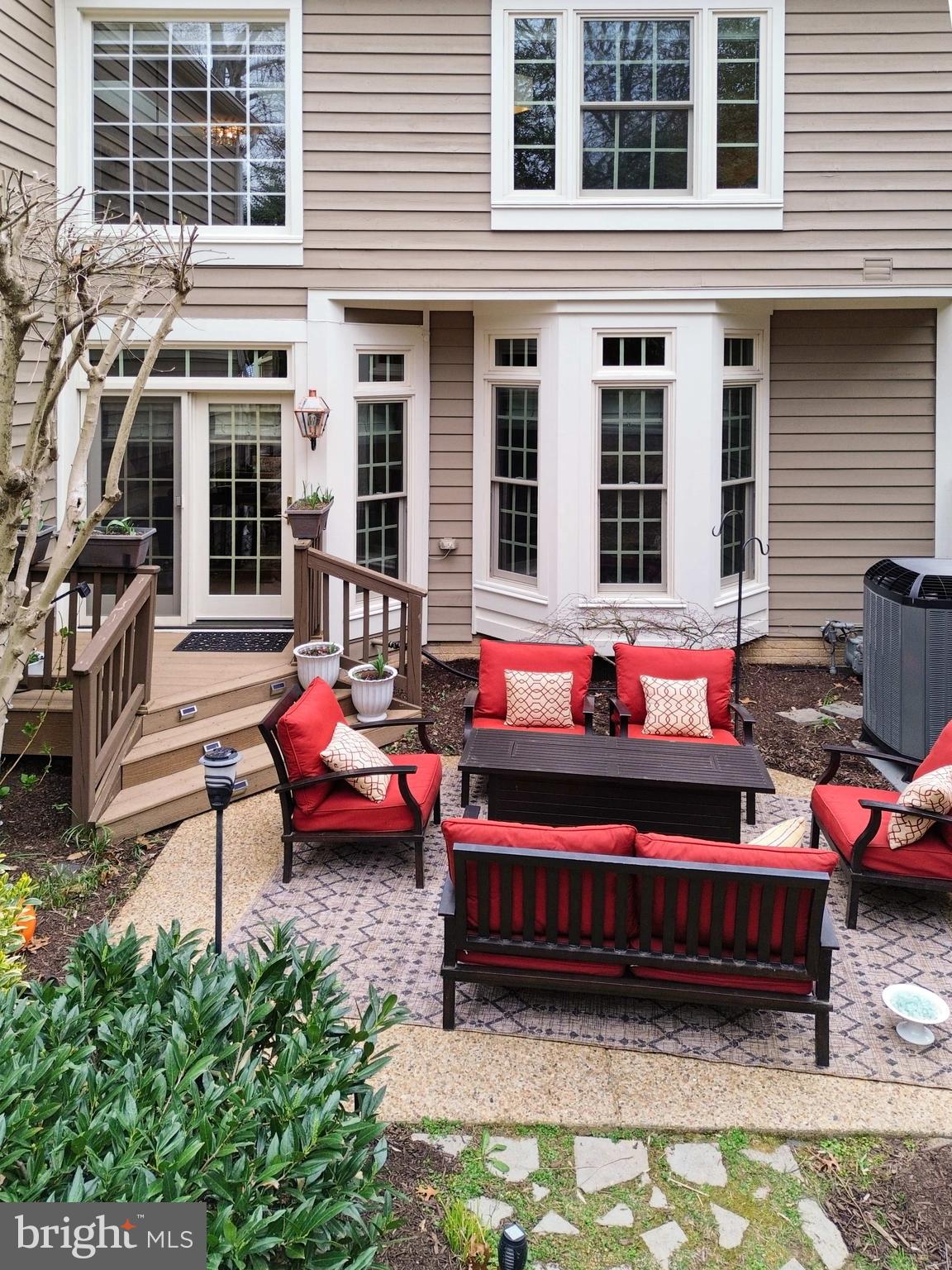 11423 Hollow Timber Way Reston, VA 20194 - Photo 49 of 68 a backyard of a house with barbeque oven table and chairs