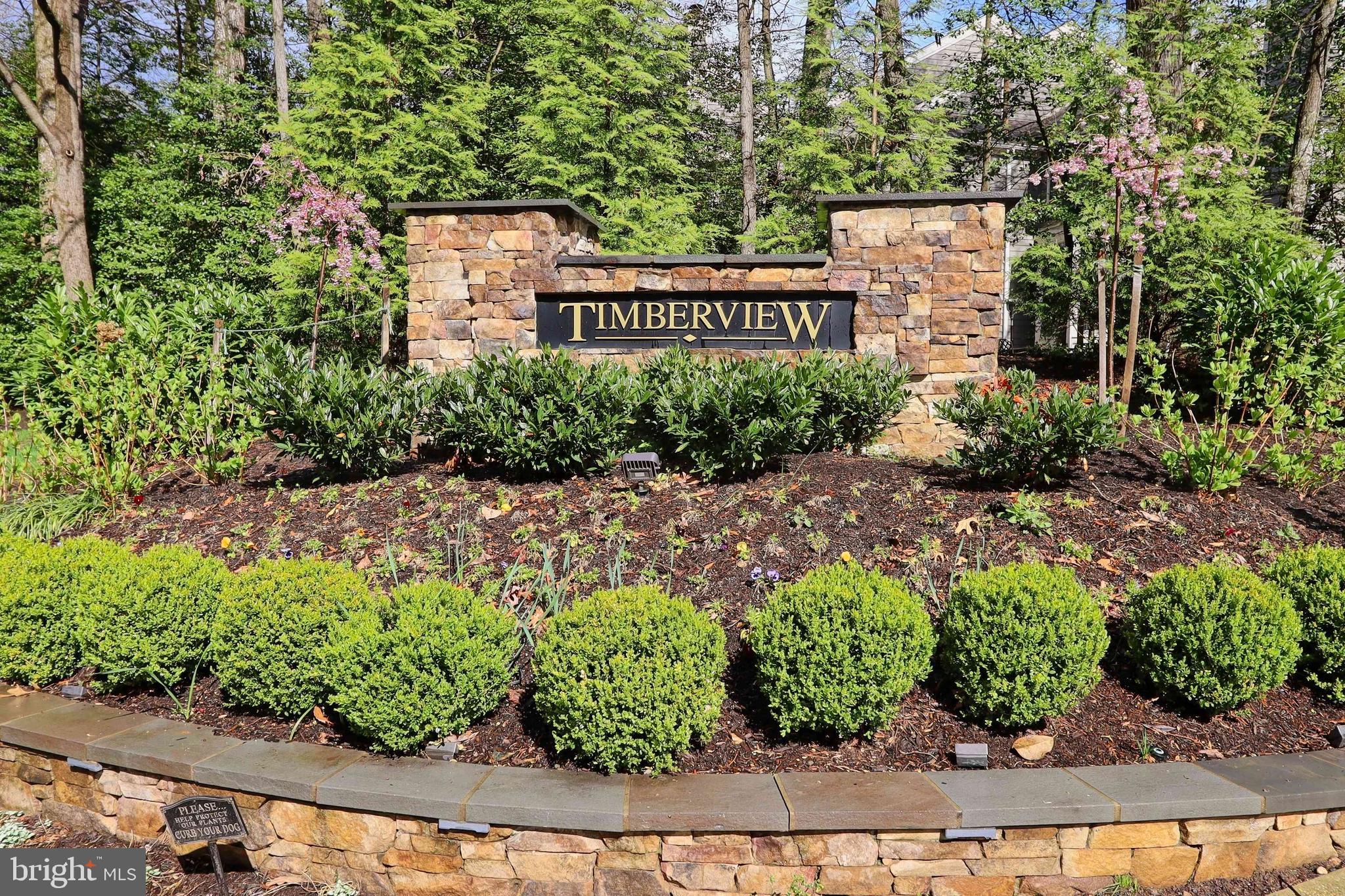 11423 Hollow Timber Way Reston, VA 20194 - Photo 54 of 68 a sign that is sitting on a brick wall
