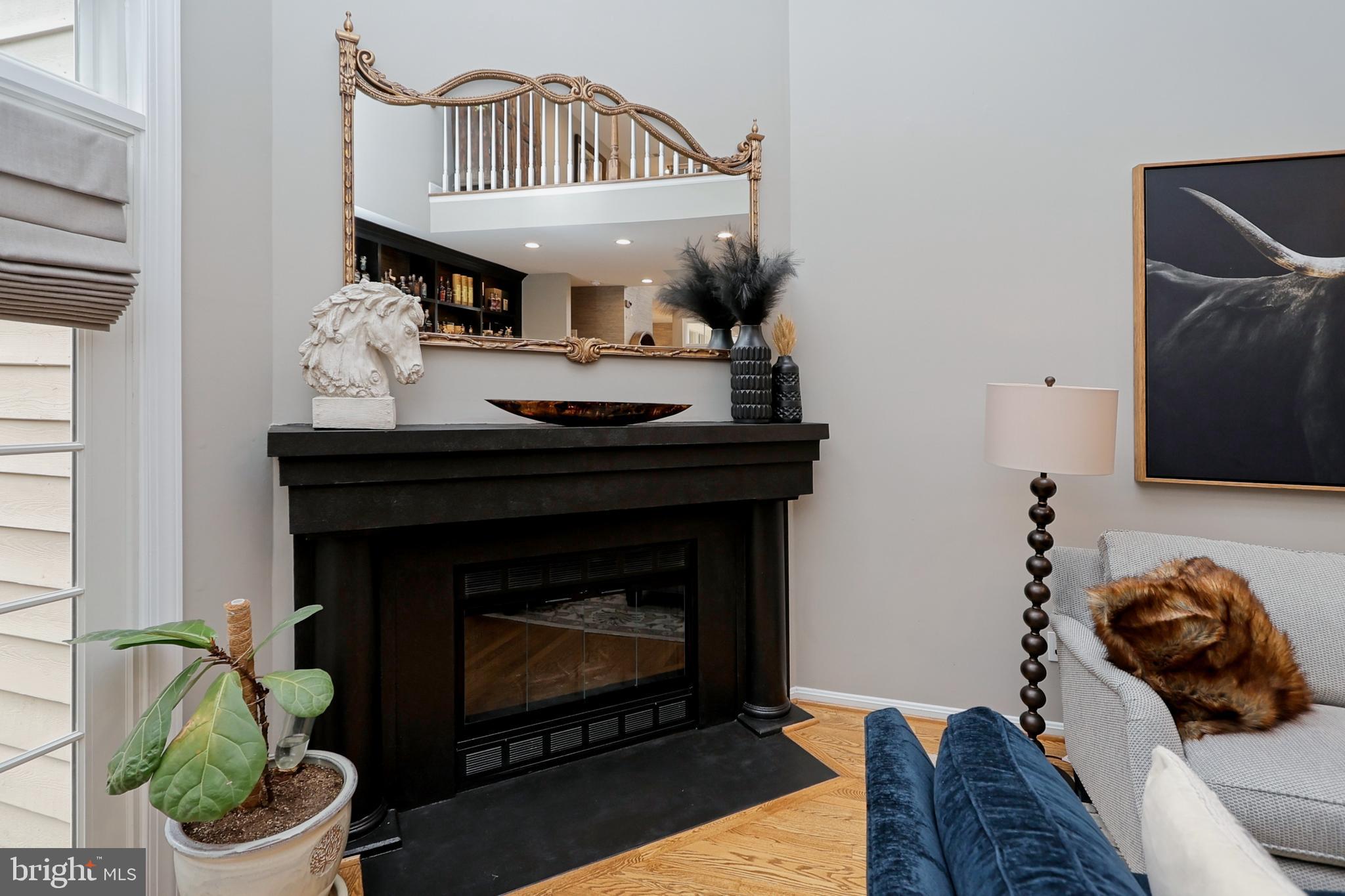 11423 Hollow Timber Way Reston, VA 20194 - Photo 8 of 68 a living room with furniture and a fireplace