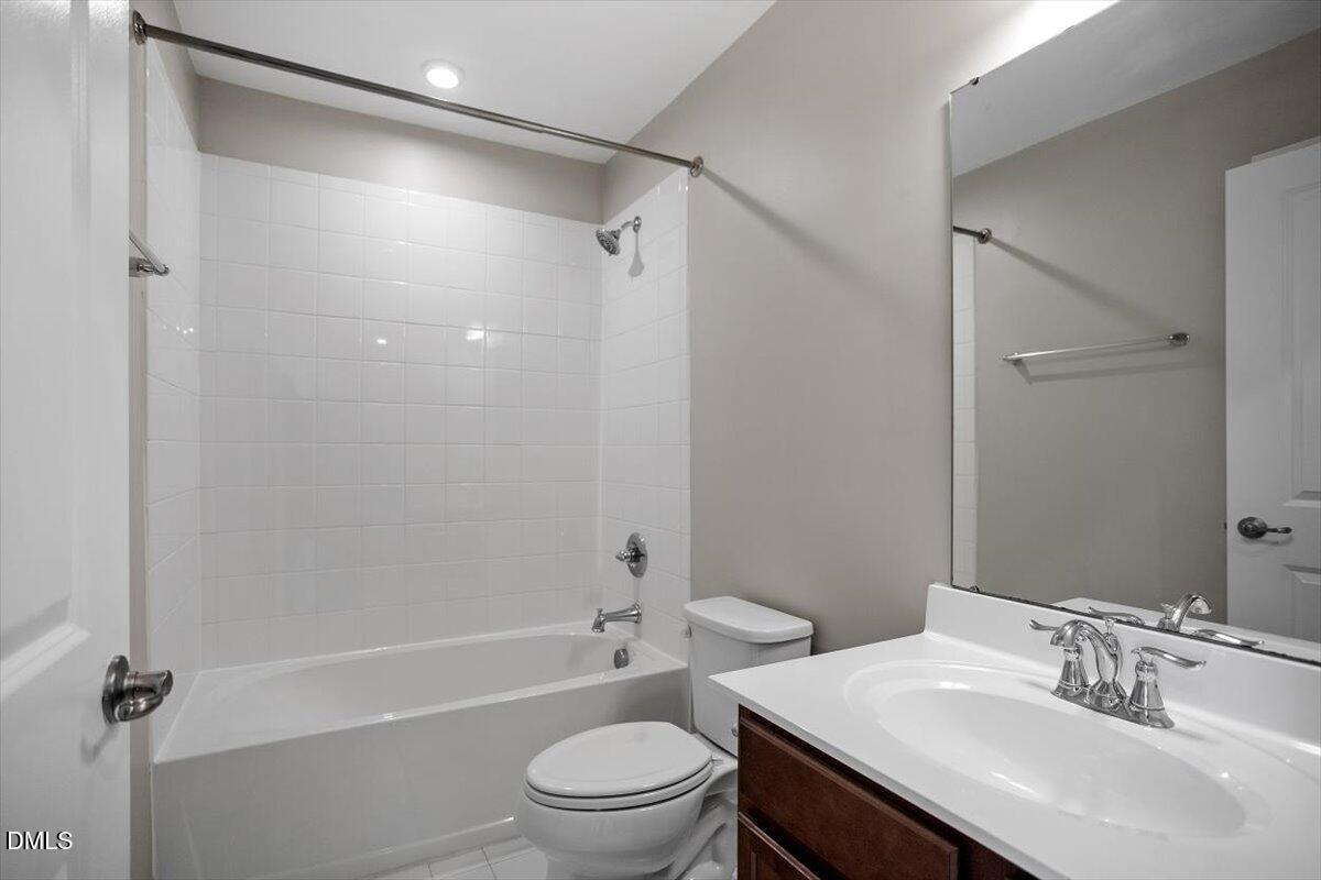 117 Brier Ridge Drive Durham, NC 27703 - Photo 23 of 29 a bathroom with a sink a toilet and shower