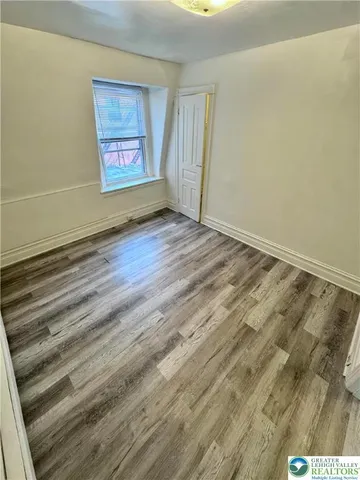 a view of an empty room and window