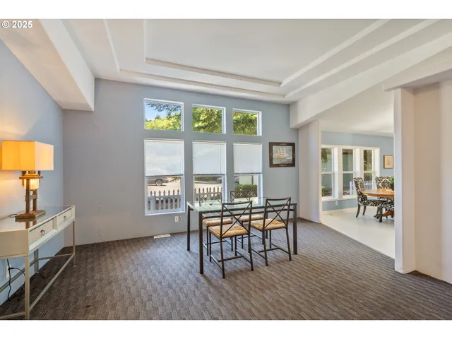 a view of a livingroom with furniture a fireplace and wooden floor