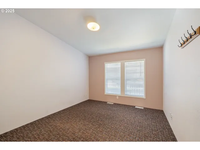 a bathroom with a sink a toilet a mirror and shower