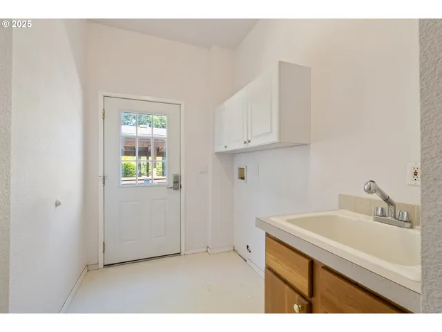 a backyard of a house with a tree