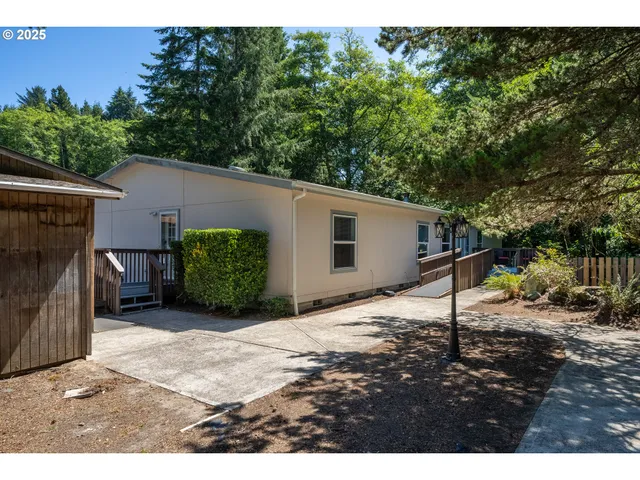 a view of a house with backyard porch and sitting area