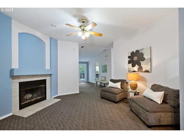 a living room with furniture and a fireplace