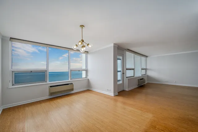 a view of an empty room with a window