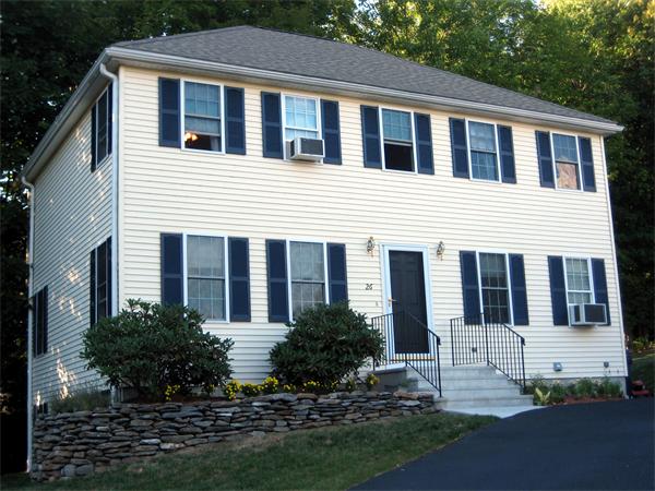26 Castle Road Fitchburg, MA 01420 - Photo 1 of 1 a front view of a house with a yard outdoor seating and garage