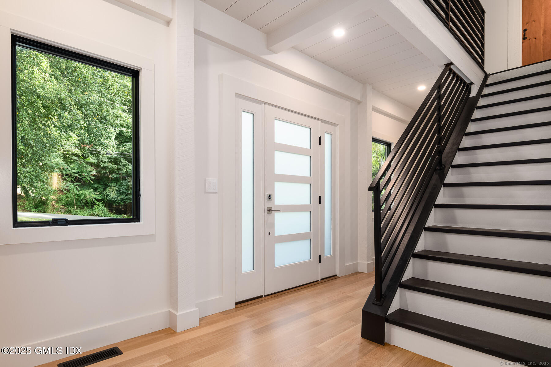 10 Tomahawk Lane Greenwich, CT 06830 - Photo 6 of 34 a view of entryway with stairs and wooden floor