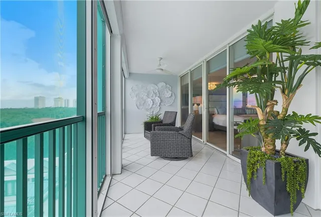 a view of a balcony with potted plants