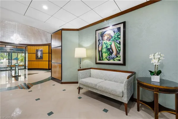 a spacious bedroom with a bed and a painting on the wall